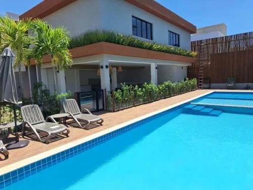 Kolam renang di atau dekat dengan Buraquinho I Villas Praia Moderno e Aconchegante