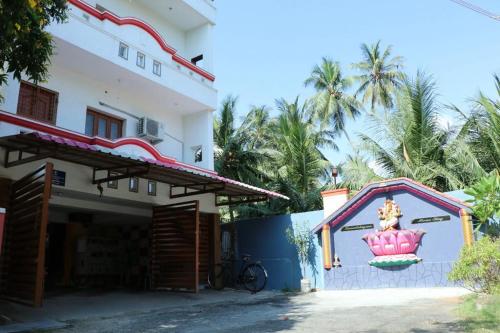 a building with a mural on the side of it at Maass Homestay in Puducherry