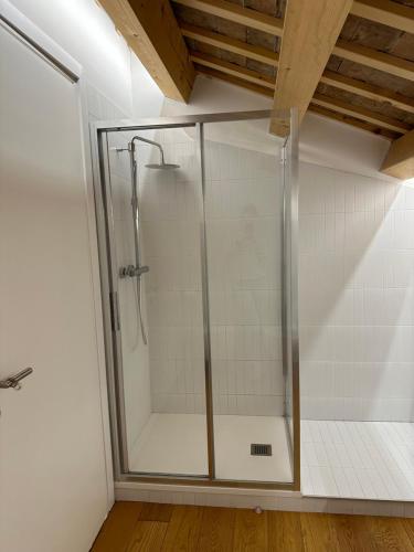 a shower with a glass door in a bathroom at Locanda del Delta in Comacchio