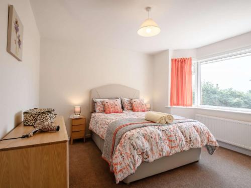 a bedroom with a bed and a window at 2 bed in Poole 85399 in Lytchett Matravers