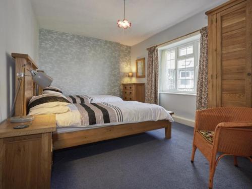 a bedroom with a large bed and a window at 3 Bed in Grange in Borrowdale SZ262 in Grange