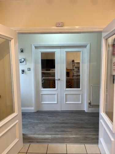 a hallway with doors in a house at Rockmount Court in Bournemouth