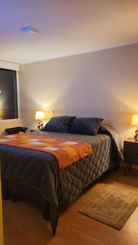 a bedroom with a large bed in a room at dpto x día Chillan 1204 in Chillán