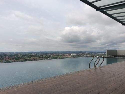 a view of a body of water from a building at TopRoof Pool 2-6pax 5minJonker in Melaka