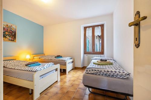 Krevet ili kreveti u jedinici u okviru objekta Casa Luisa Lake Garda