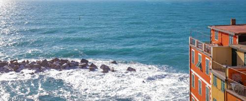 a view of the ocean from a building at Alla Marina Affittacamere in Riomaggiore