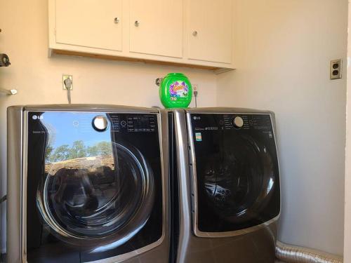 two microwaves sitting next to each other in a kitchen at Peaceful Yosemite Retreat-King Suite-Pet Friendly in Oakhurst