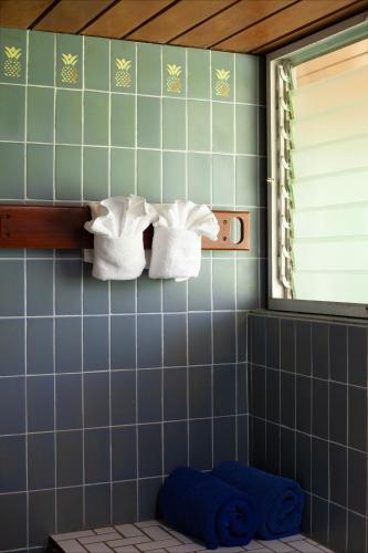 two towels on a shelf in a bathroom at Frenchman's Cove Resort in Port Antonio