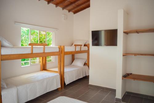Krevet ili kreveti na sprat u jedinici u okviru objekta Hotel Punta Piedra