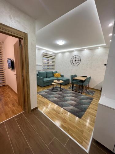 a living room with a couch and a table at Apartman Babin in Zlatibor