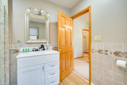 a bathroom with a sink and a mirror at Pet-Friendly New Egypt Home with Fenced Pool and Grill in Cookstown