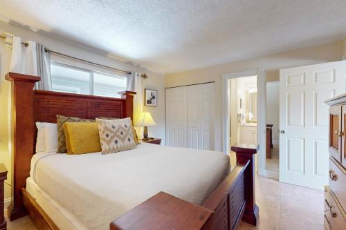 a bedroom with a large bed and a window at Gulf Terrace 287 in Destin