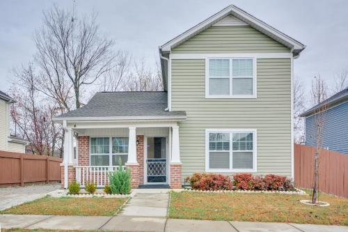 a house with a fence in front of it at 4 Mi to HPU Pet-Friendly Home with Yard! in High Point