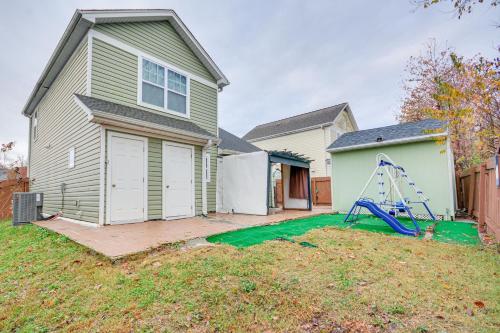 a house with a yard with a swing at 4 Mi to HPU Pet-Friendly Home with Yard! in High Point