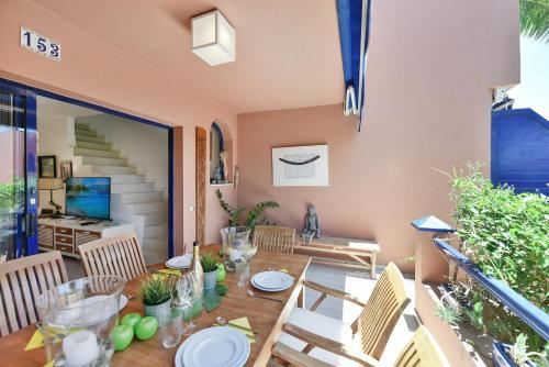 a dining room with a table and chairs at Blue Bay 153 by VillaGranCanaria in Meloneras