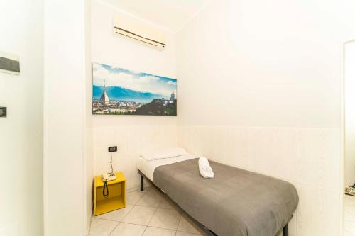 Hotel Cristallo Torinoにあるベッド