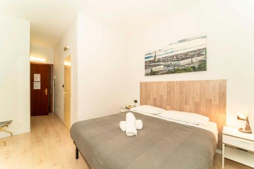 Hotel Cristallo Torinoにあるベッド