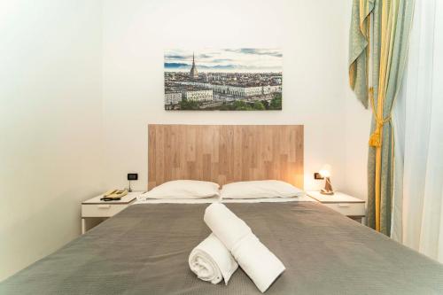 Postel nebo postele na pokoji v ubytování Hotel Cristallo Torino
