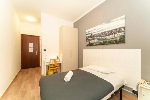 Hotel Cristallo Torinoにあるベッド
