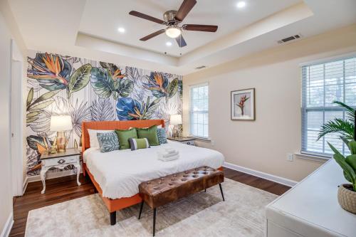 a bedroom with a bed and a ceiling fan at Family Home Near Downtown and Convention Center! in Savannah