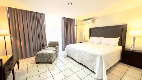 Giường trong phòng chung tại Gran Hotel Paris