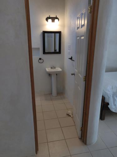 a bathroom with a sink and a mirror at Villas Del Mar in Celestún