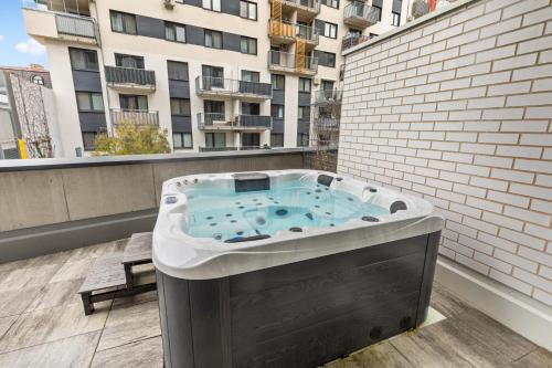 a hot tub on the balcony of a building at LAM Jegeho Alej - JACUZZI - FREE PARKING in Bratislava