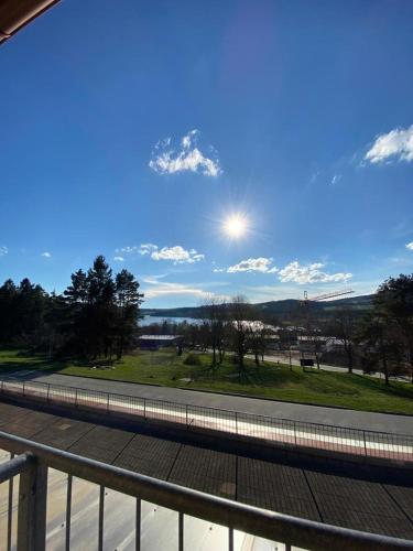 a view of a road with the sun in the sky at Lipno Klidné centrum in Lipno nad Vltavou