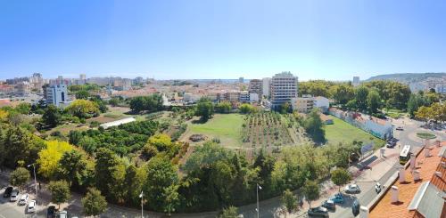 an aerial view of a park in a city at Seaview & Sunset Balcony Charm, BY TimeCooler in Setúbal
