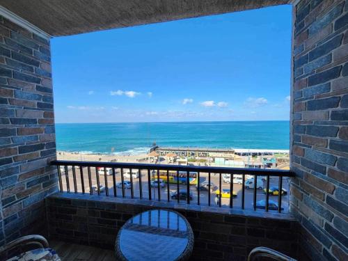 a balcony with a view of the ocean at Amazing Sea View 2 bedroom apartment in Alexandria