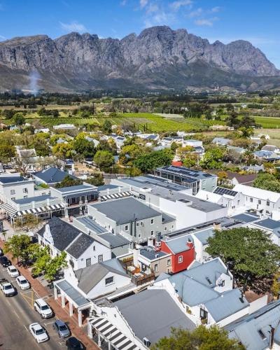 an aerial view of a town with mountains in the background at Le Grenier Luxury Loft in Franschhoek