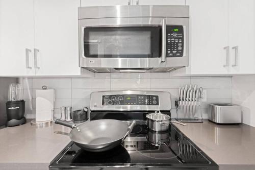 a kitchen with a stove with a bowl on the stove at The Hidden Gem, King bed & Swimming Pool! in Chandler