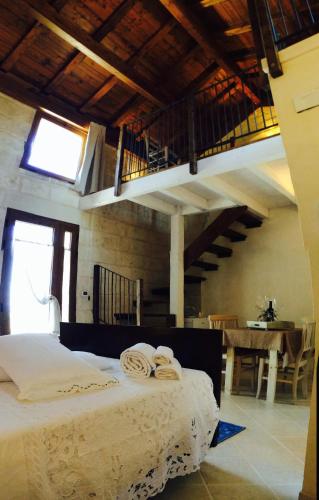 Postel nebo postele na pokoji v ubytování Agriturismo La Palascìa Masseria Agreste