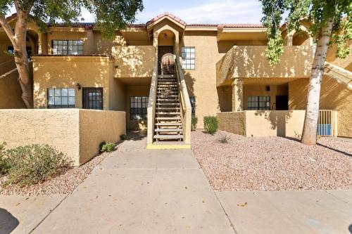 a house with a staircase in front of it at The Hidden Gem, King bed & Swimming Pool! in Chandler