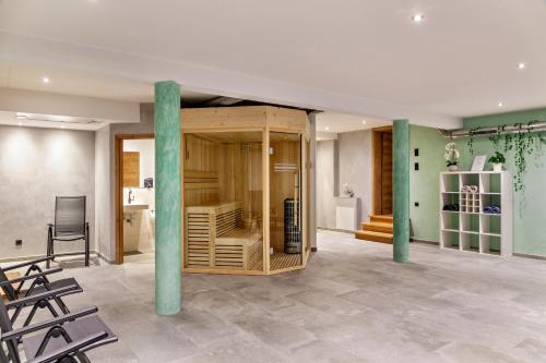 a room with a wooden cabinet with two poles at Chalet Aus Holz in Garmisch-Partenkirchen