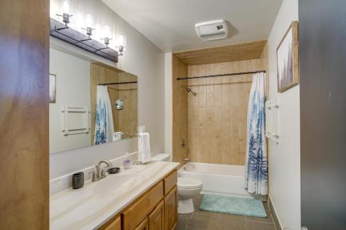 a bathroom with a sink and a toilet and a tub at Ruidoso Cabin Retreat with Multi-Level Deck in Ruidoso