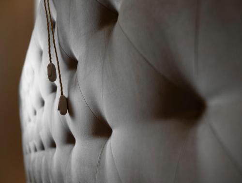 a close up of a person wearing a necklace at Palazzo Giusti Suites and Spa in Urbino