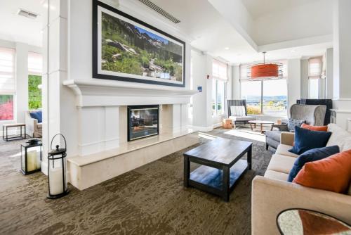 a living room with a fireplace and a tv at Shutters Hotel in Elko