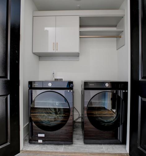 a kitchen with two dishwashers and a microwave at Loft Style Spacious Lux Apt 102, Sleeps 6 in Atlanta