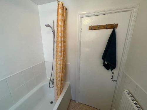 a bathroom with a shower and a bath tub at Modern 3BD Home Doncaster South Yorkshire in Doncaster