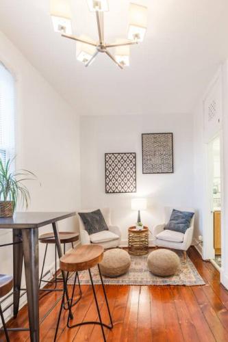 a living room with a table and chairs at Stylish Flat in Walkable Downtown w Parking in Cincinnati