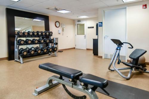a gym with two exercise bikes and a mirror at Shutters Hotel in Elko
