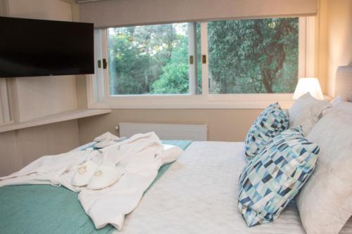 Un pat sau paturi într-o cameră la Hotel Cozumel Sierra