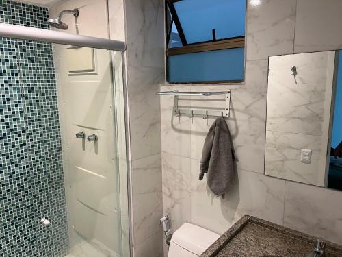 a bathroom with a shower and a toilet at Porto Beach Resort - Beach Class Muro Alto in Porto De Galinhas