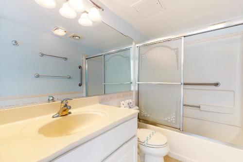 a bathroom with a sink and a shower and a toilet at Golden Sands 613 in Ocean City