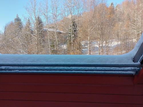 a snow covered roof on top of a house at Apartament Alias in Wisła