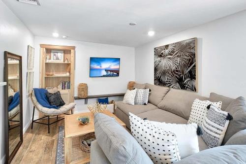 a living room with a couch and a table at Dreamprint Delmar in Naples