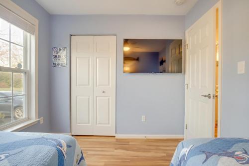 a bedroom with two beds and a door at 3 Mi to Bethany Beach Gem with Deck and Pool Access in Ocean View