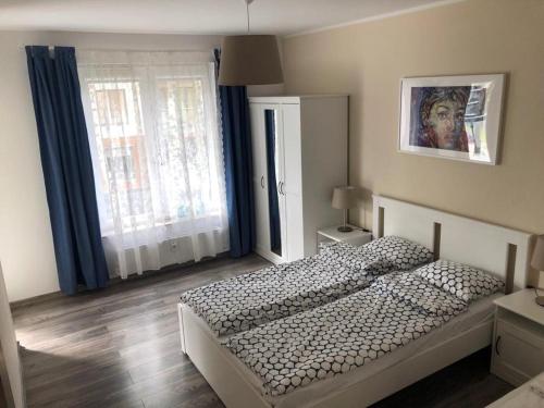 Säng eller sängar i ett rum på Apartament Polanki Kołobrzeg