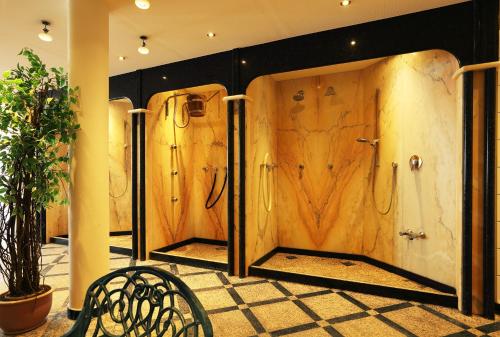 a row of lockers in a room with a bench at Hotel Waldesrand in Herford